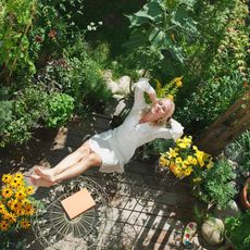 A woman relaxing in a garden