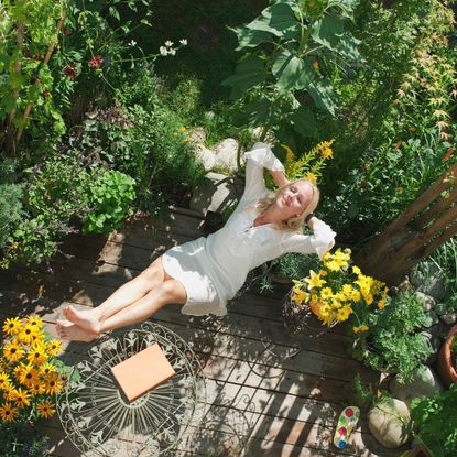A woman relaxing in a garden