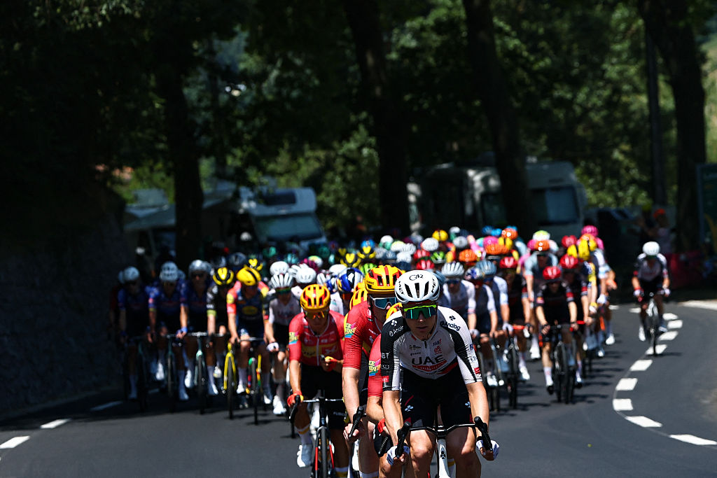 The pack of riders (peloton) cycles in the Col d'Aspin ascent during the 6th stage of the 113th edition of the Tour de France cycling race, 186,2 km between Pau and Gavarnie-G&amp;egrave;dre in the French Pyrenees, on July 9, 2026. (Photo by Anne-Christine POUJOULAT / AFP)