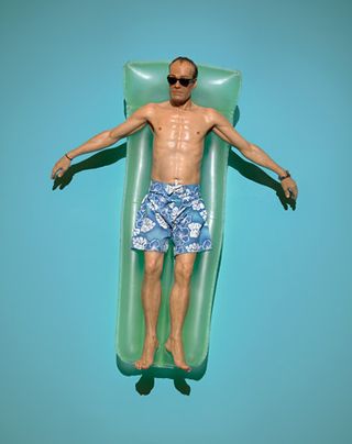 Man floating on swimming tube.