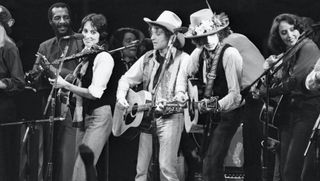 (from left) Richie Havens, Joan Baez, Ramblin' Jack Elliott, Bob Dylan, and others perform at a benefit concert for Rubin "Hurricane" Carter
