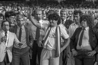 Diego Maradona is presented to Napoli fans after his signing from Barcelona in July 1984.