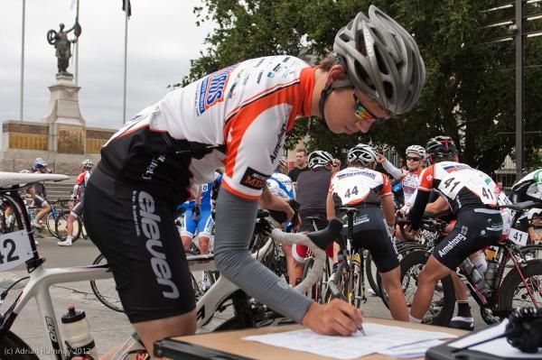 Riders sign on for the start of stage 2.