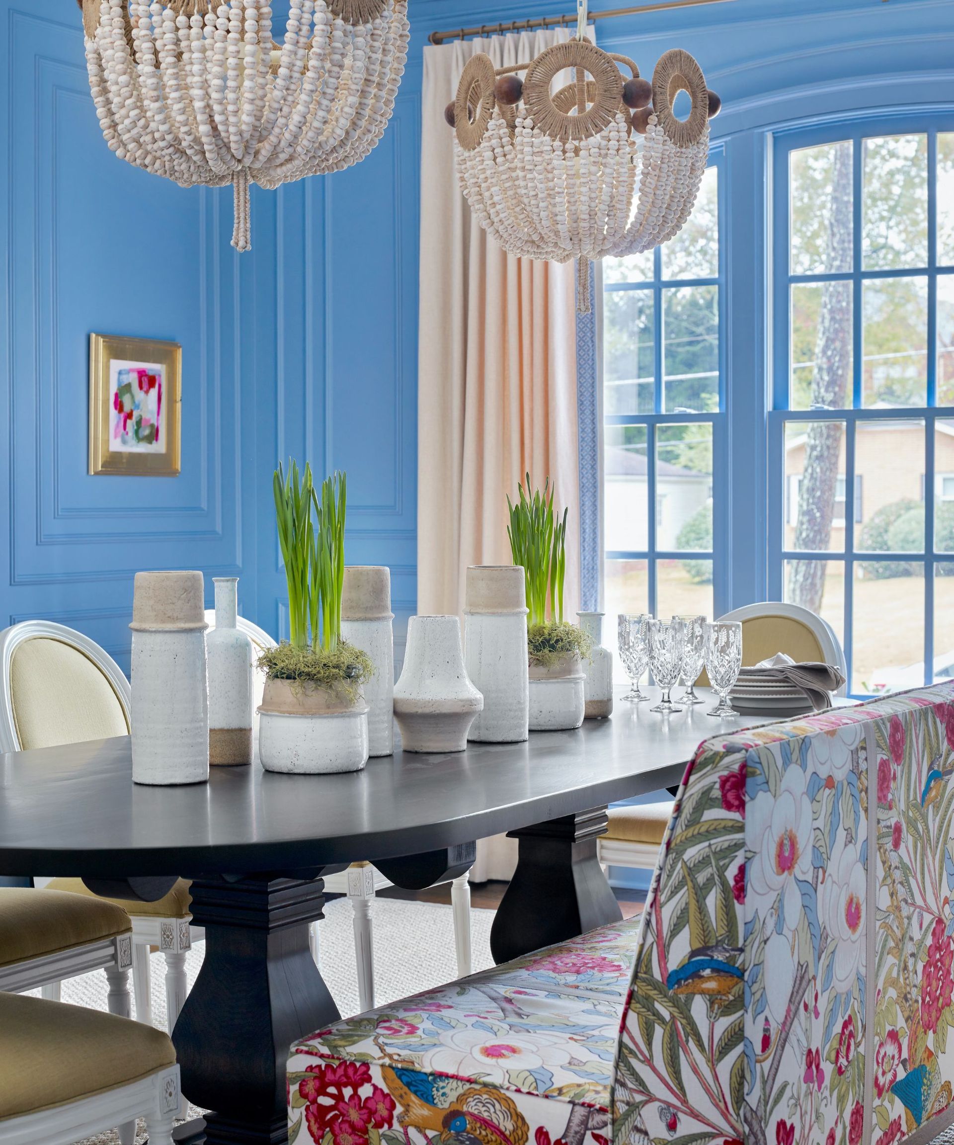 dining room with blue walls and floral pattern bench seats