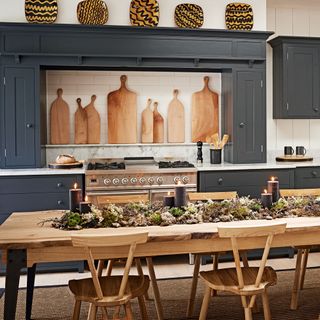 kitchen with chopping boards and long wooden table