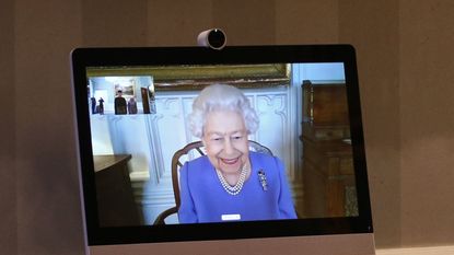 london, england december 10 queen elizabeth ii appears on a screen by videolink from windsor castle, where she is in residence, during a virtual audience to receive his excellency the high commissioner for brunei darussalam first admiral pengiran dato seri pahlawan norazmi bin pengiran haji muhammad and his wife, pg datin noralam binti pg hj kahar, who were at londons buckingham palace on december 10, 2020 in london, england photo by yui mok wpa poolgetty images