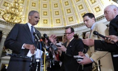 Attorney General Eric holder speaks to reporters following his meeting on Capitol Hill on June 19: Holder faces a vote by the House of Representatives on whether to hold him in contempt for r