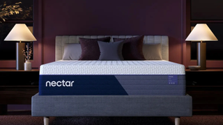 Nectar Luxe Hybrid mattress on a bed frame in a well lit bedroom