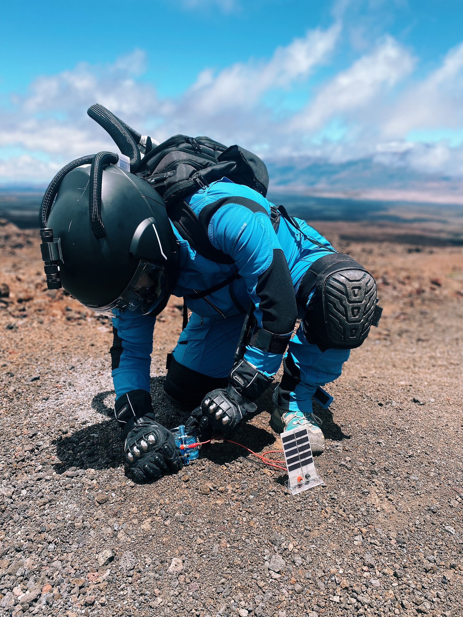 Phillips performing her hydrogen fuel cell research during a Marswalk.