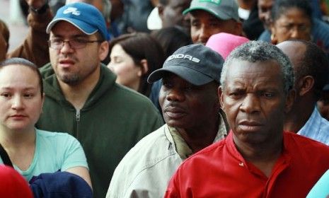 Homeowners wait in line for a foreclosure prevention seminar in Florida