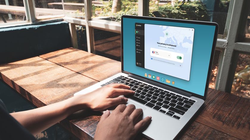 A person using a laptop with Norton VPN activated.