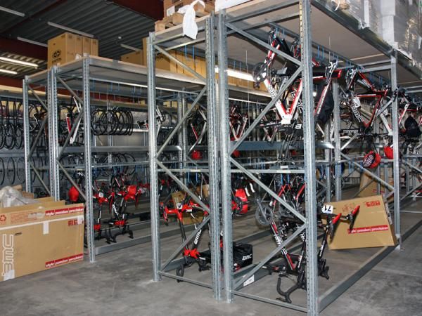Double-height racks are used to store BMC's team bikes in the service course. Bikes are stored without wheels attached since those can vary so much from one event to the next.