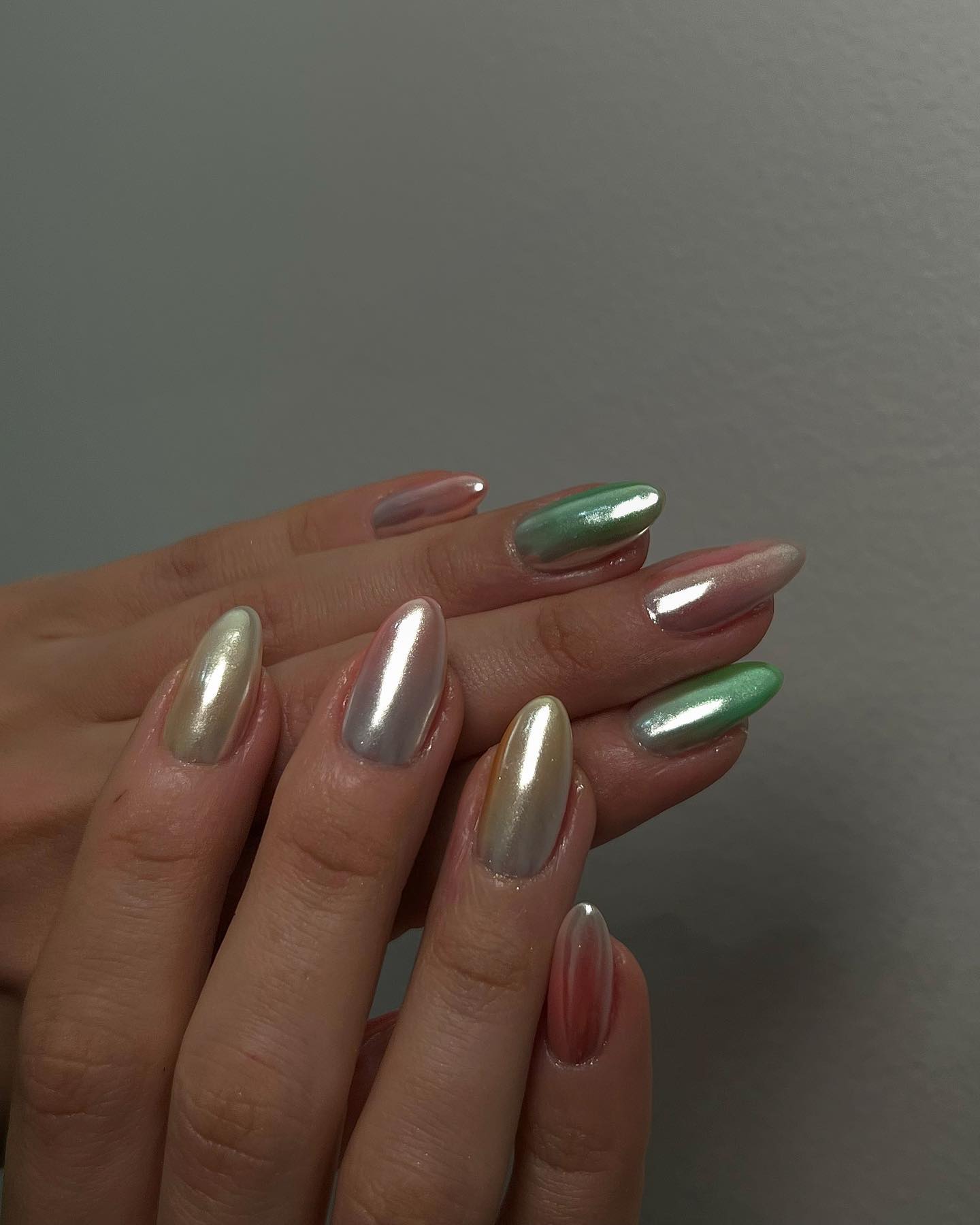 Multicolored chrome nails.