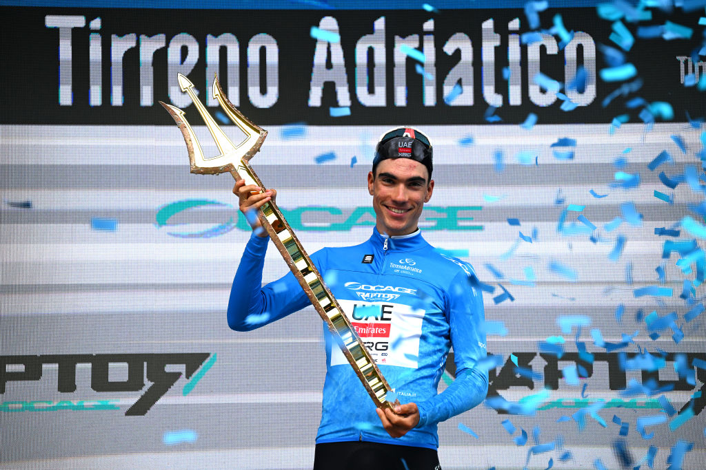 SAN BENEDETTO DEL TRONTO ITALY MARCH 16 Juan Ayuso Pesquera of Spain and UAE Team Emirates XRG Blue Leader Jersey celebrates at podium as final overall race winner during the 60th TirrenoAdriatico 2025 Stage 8 a 147km stage from Porto Potenza Picena to San Benedetto del Tronto UCIWT on March 16 2025 in San Benedetto del Tronto Italy Photo by Tim de WaeleGetty Images