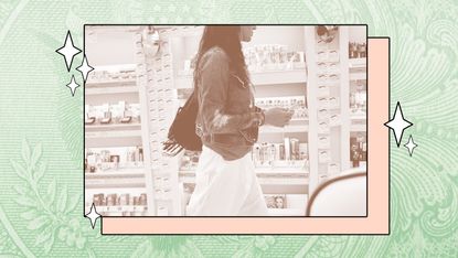 A young woman walks through an aisle at Ulta.