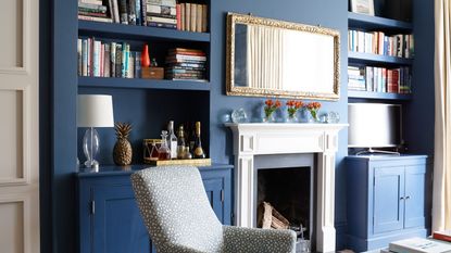 white living rooms with grey armchair