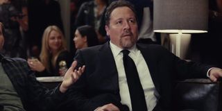 Spider-Man: Far From Home Happy Hogan sits on a couch, with a slight look of disbelief