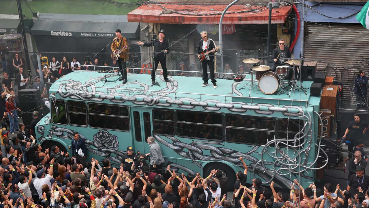 U2 filming their Street Of Dreams video on top of a bus in Mexico City