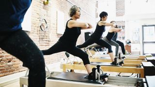 woman at Pilates for beginners class on reformer
