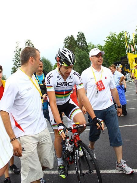 Cadel Evans (BMC) gets escorted to the starting line.