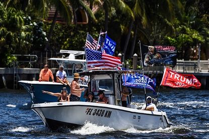 Boaters celebrate Trump's birthday.