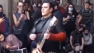 Rammstein guitarist Richard Kruspe plays for fans on a street in Mexico