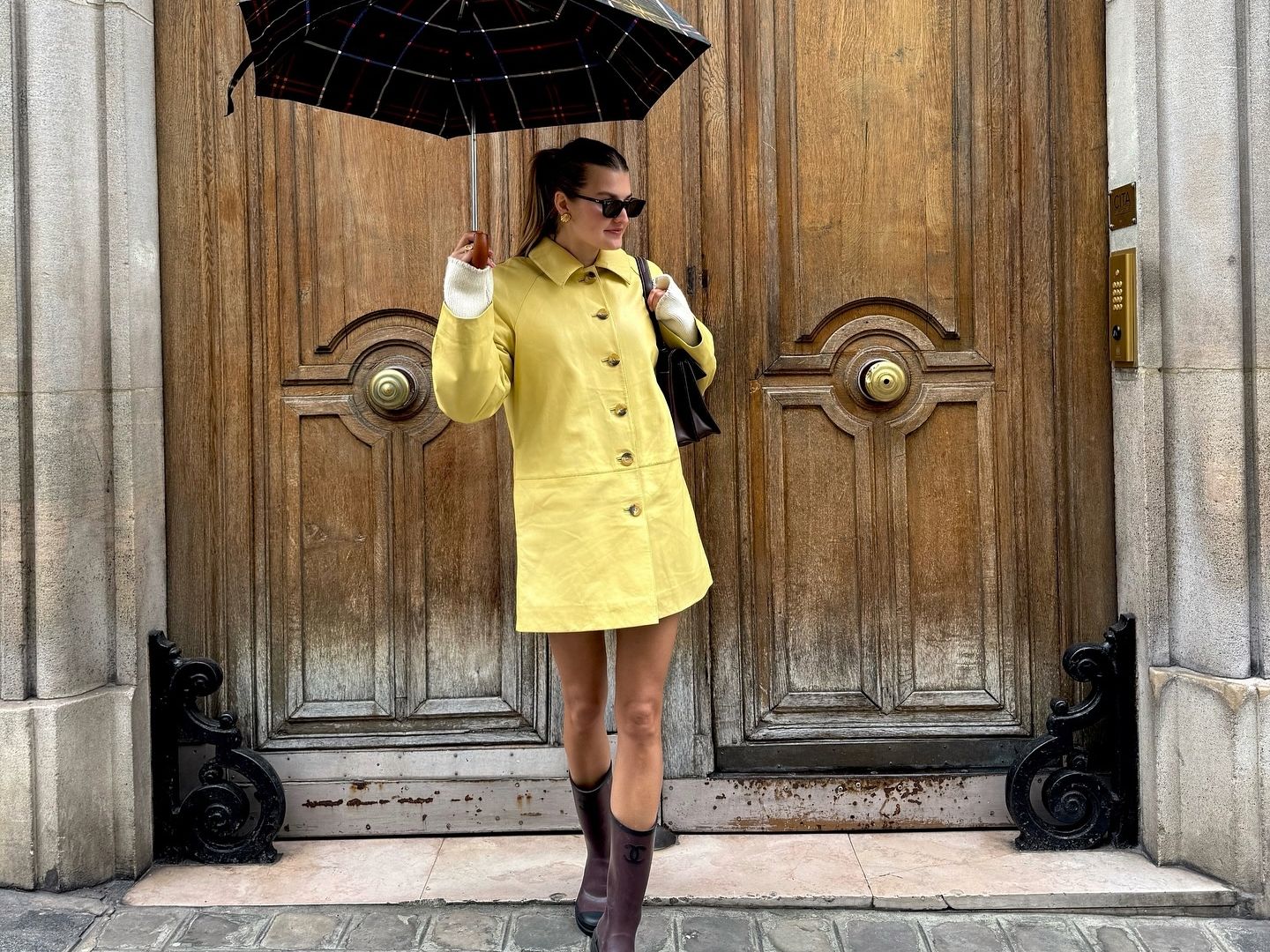 Sara Walker in a yellow Reformation jacket.