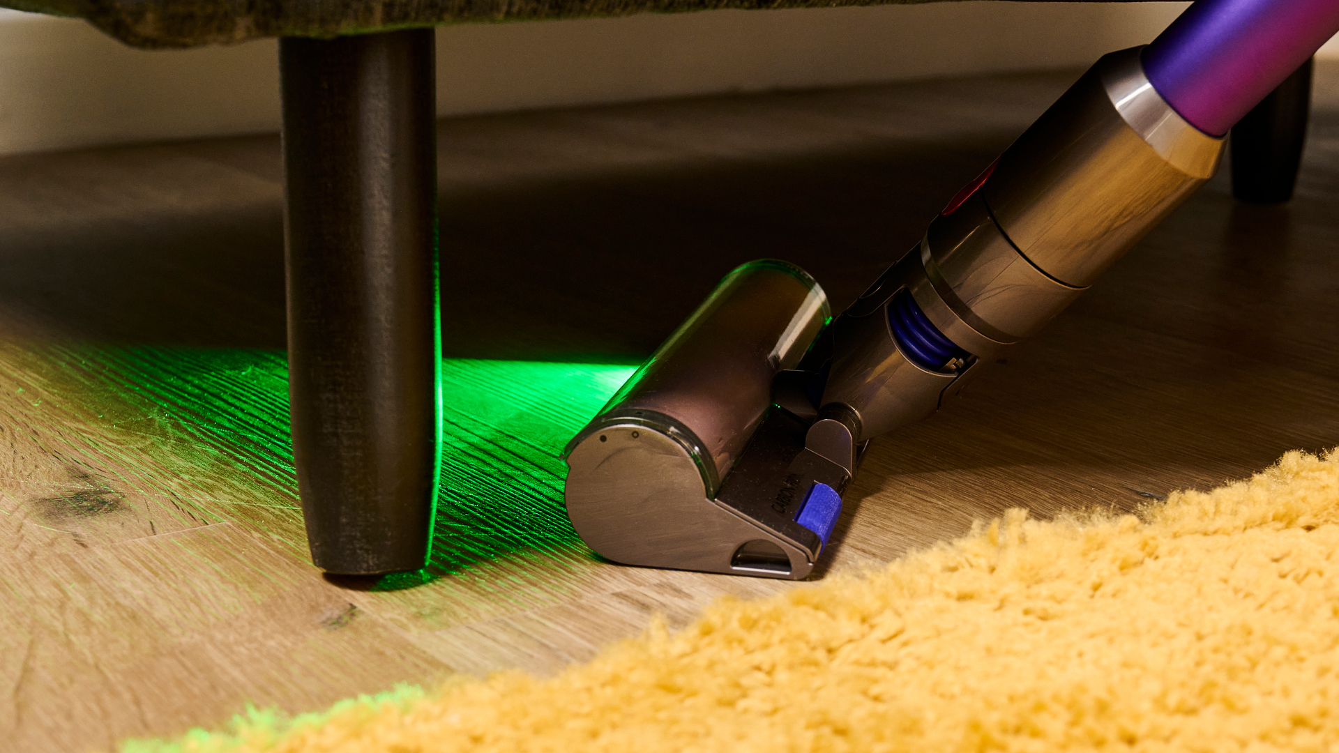 Dyson Fluffy Optic Floorhead, lit under a sofa