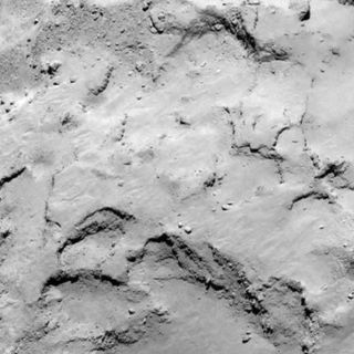 Philae lander candidate site J lies on the smaller lobe of the comet. Similar to site I, this site also presents interesting surface features with good illumination. It offers advantages for the CONSERT experiment compared with I. Image released August 25. 2014.