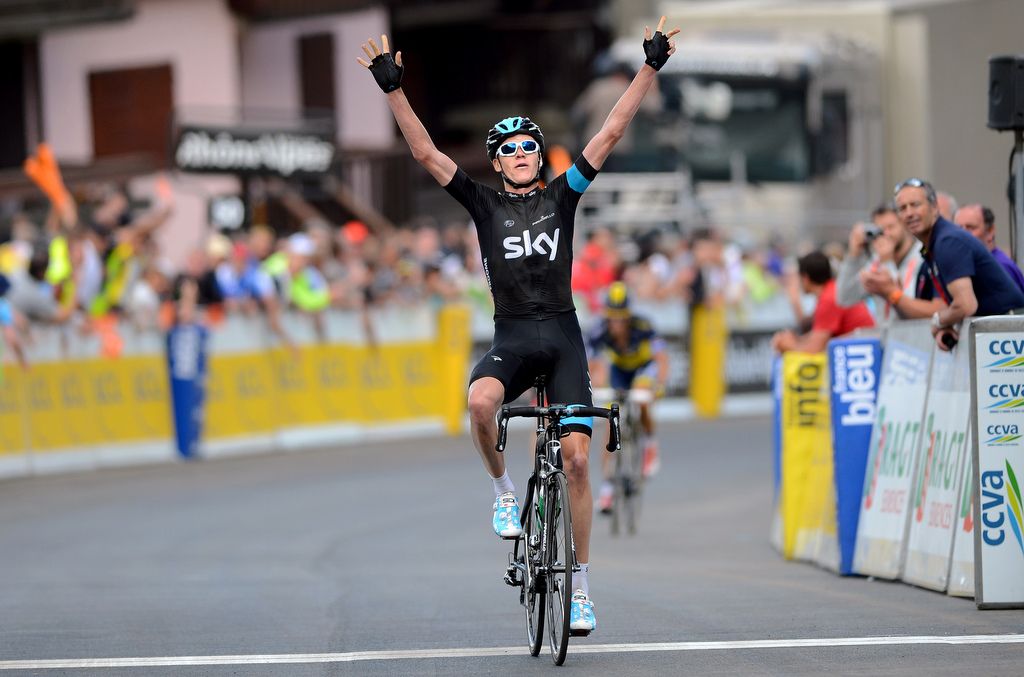 Chris Froome celebrates his first career Criterium du Dauphine jersey