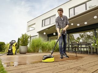 KArcher pressure washer with surface cleaner on decking