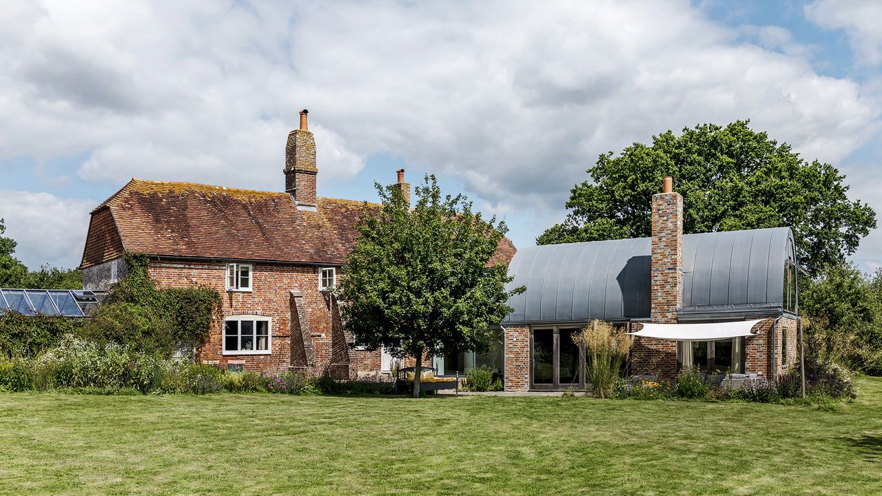 modern annex attached to brick home Polly Eltes