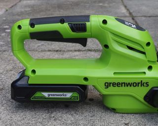 close up of a battery pack on a cordless hedge trimmer