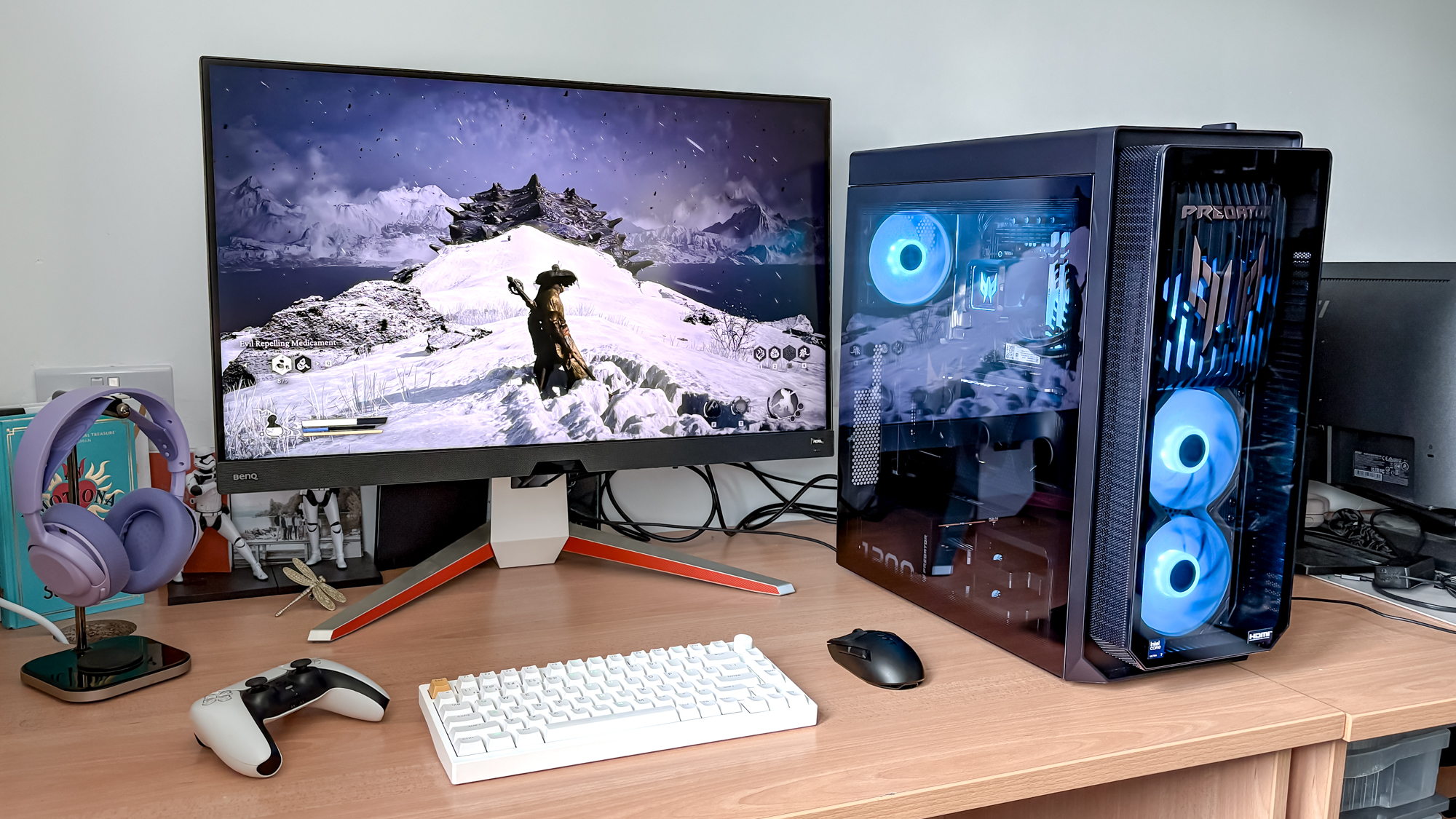 Acer Predator Orion 7000 on desk with monitor showing Black Myth Wukong games with keyboard, mouse and PS5 controller