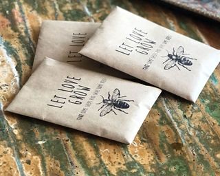 three seed packets with bees on the front