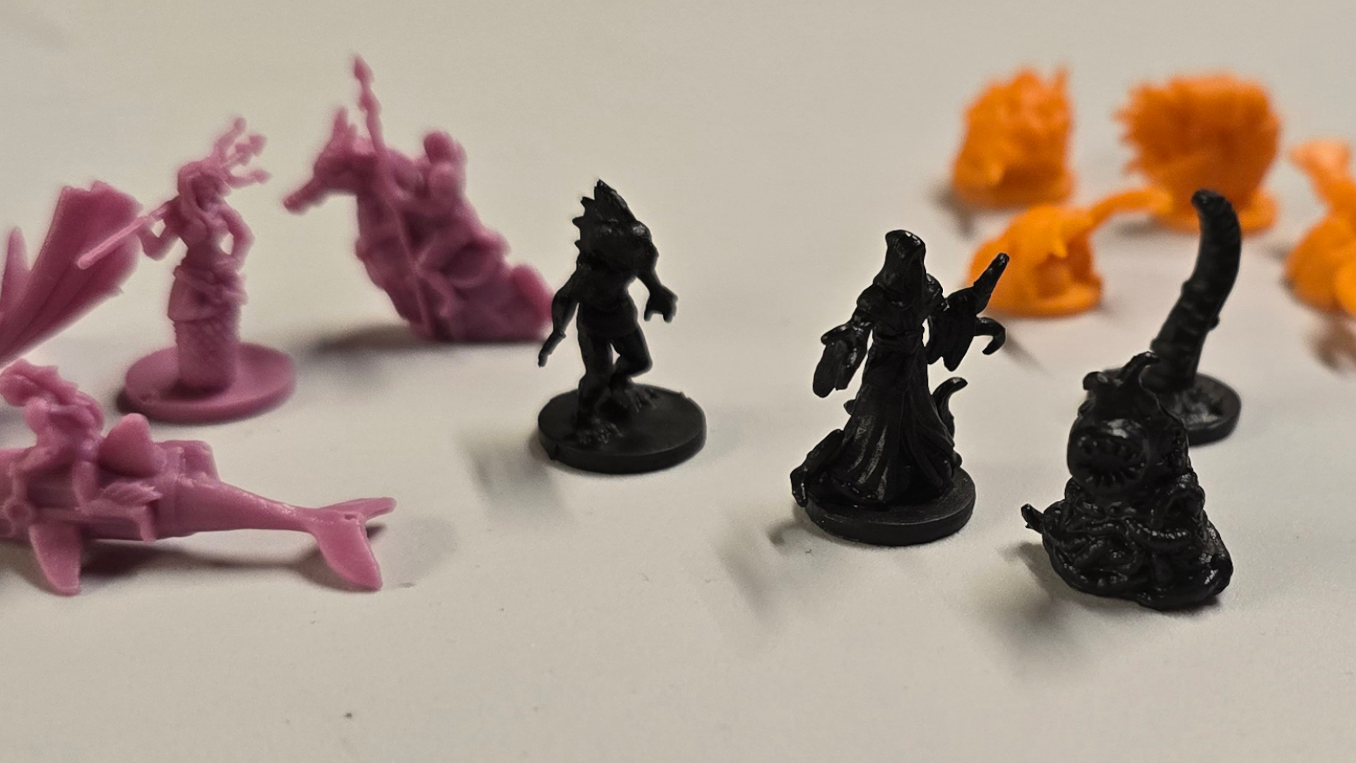 Battle for the Deep miniatures on a white surface
