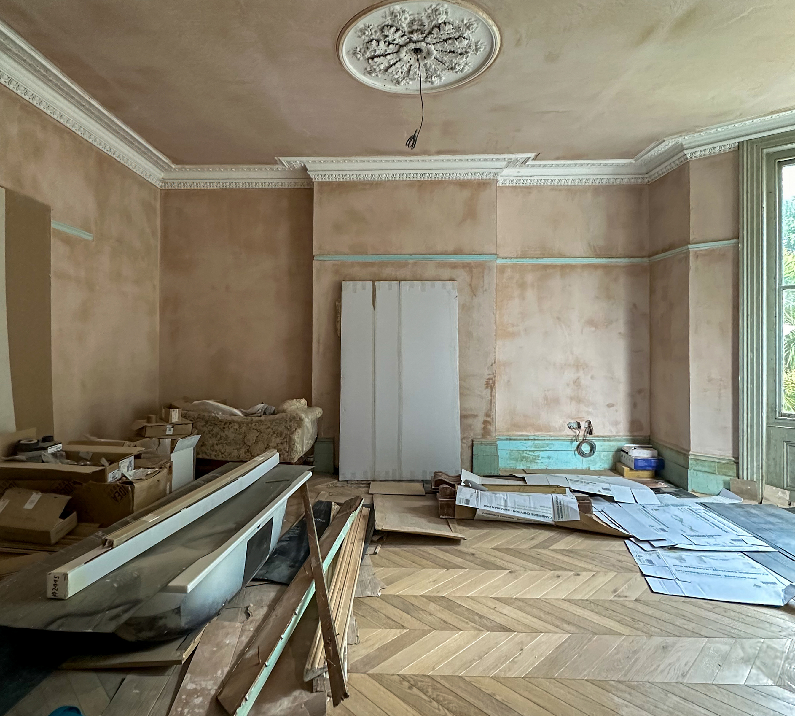 living room half decorated and filled with building materials