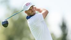 Wyndham Clark takes a shot during the Presidents Cup at Royal Montreal Golf Club