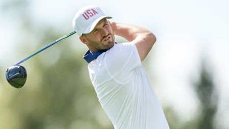 Wyndham Clark takes a shot during the Presidents Cup at Royal Montreal Golf Club