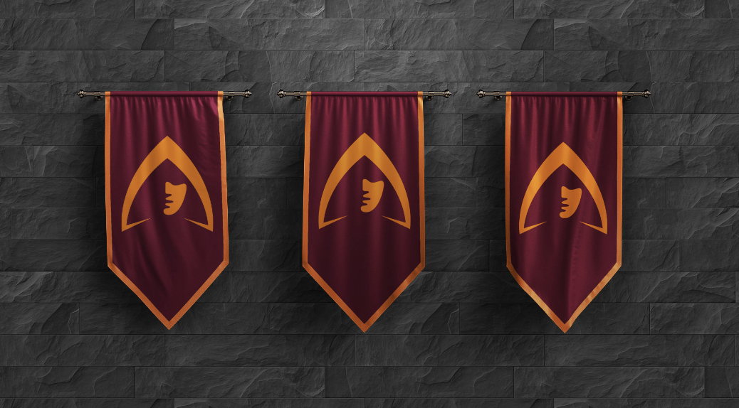 Three burgundy ceremonial banners with orange trim and the central mask logo hang against a dark stone wall.