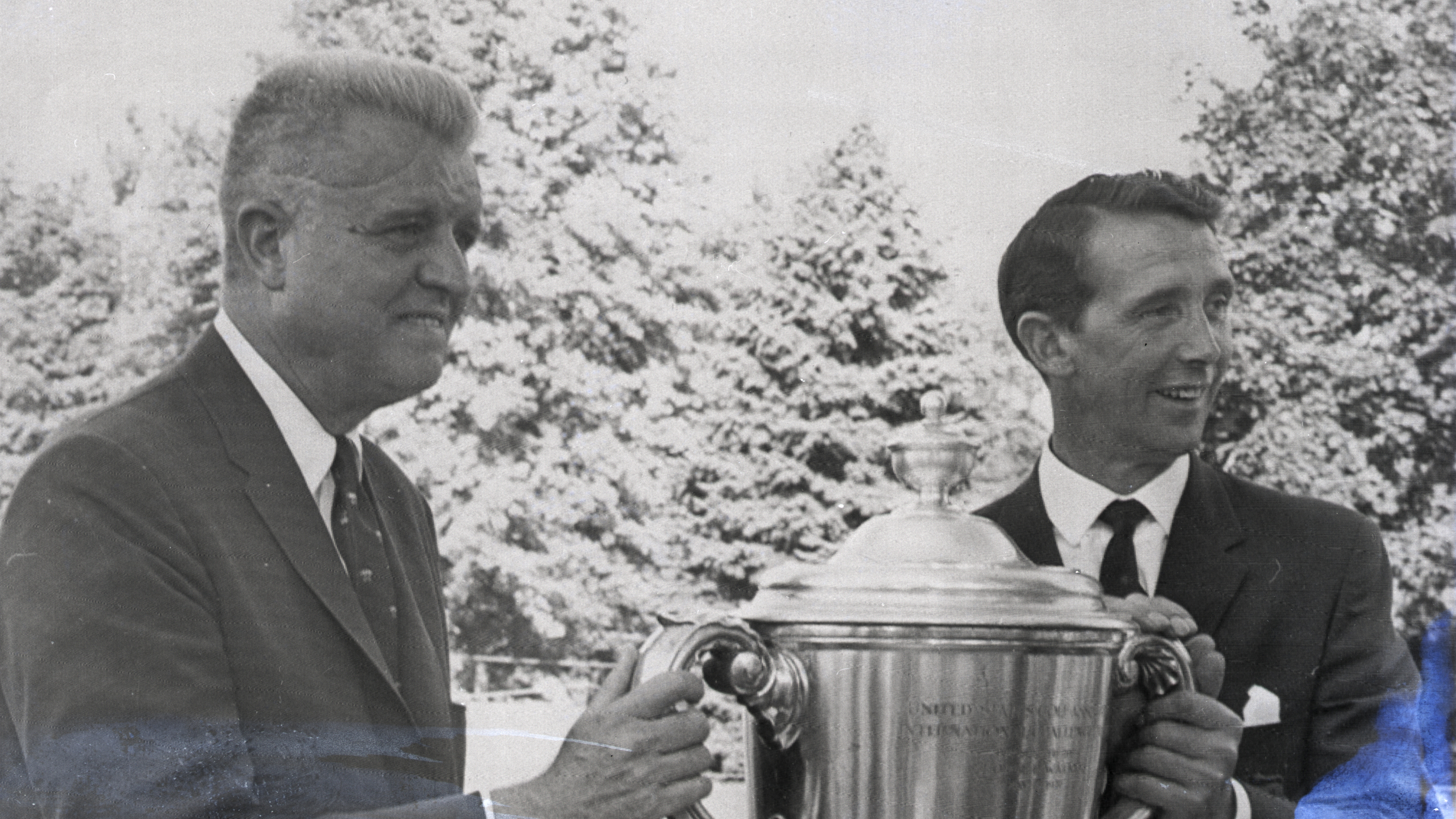 US Walker Cup team captain, Johnny Fisher (left) holds the Walker Cup with his British counterpart, Joe Carr