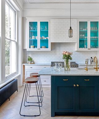 White kitchen and blue painted cabinets