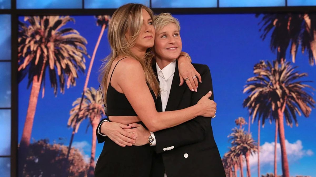 Ellen DeGeneres hugs Jennifer Aniston.