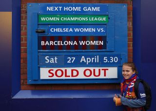 A fan of FC Barcelona stands next to the sold out fixture board ahead of the UEFA Women's Champions League 2023/24 semi-final second leg match between Chelsea FC and FC Barcelona at on April 27, 2024 in London, England. (Photo by Catherine Ivill - AMA/Getty Images)