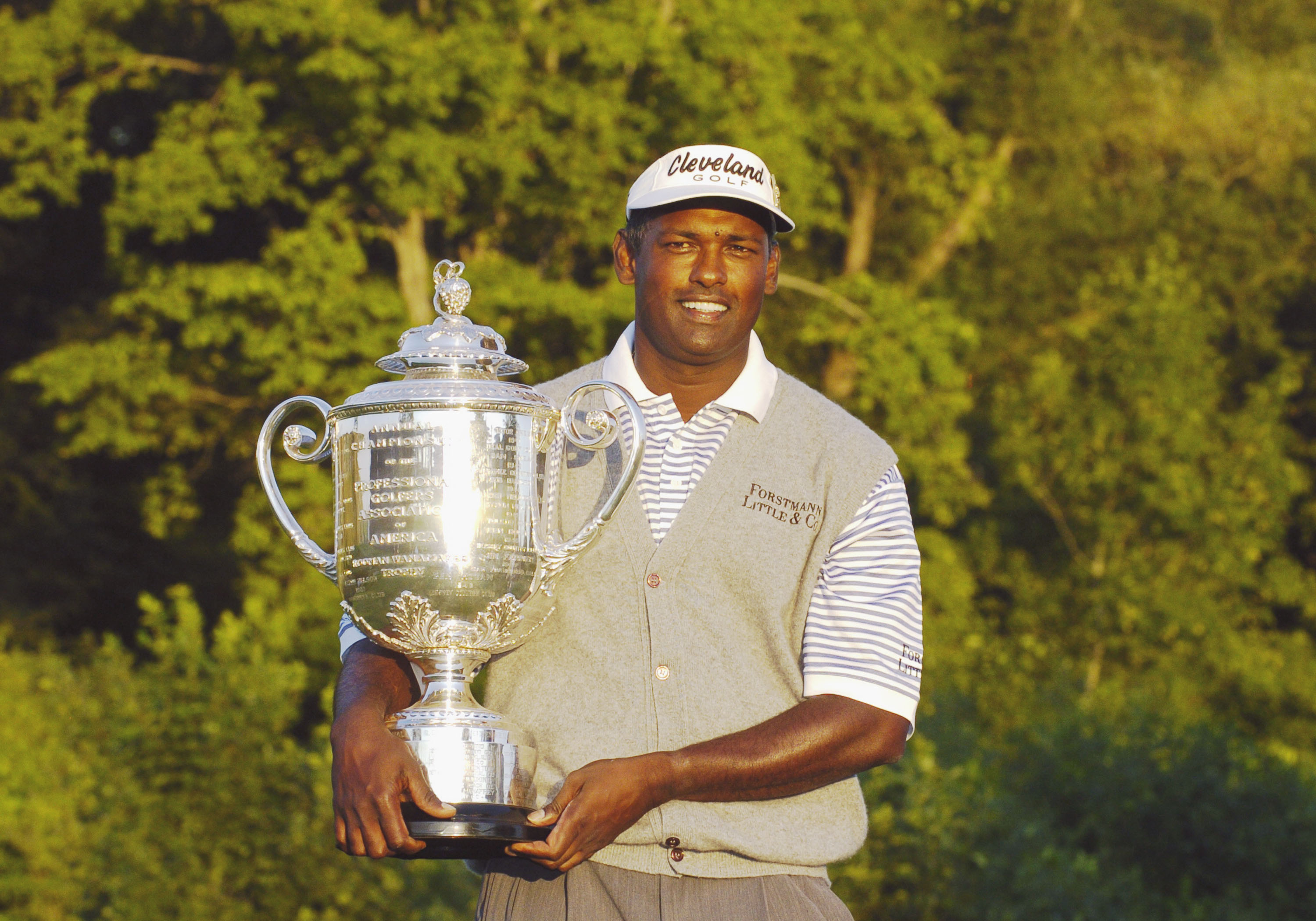 Vijay Singh poses with the PGA Championship trophy after winning for a second time in 2004