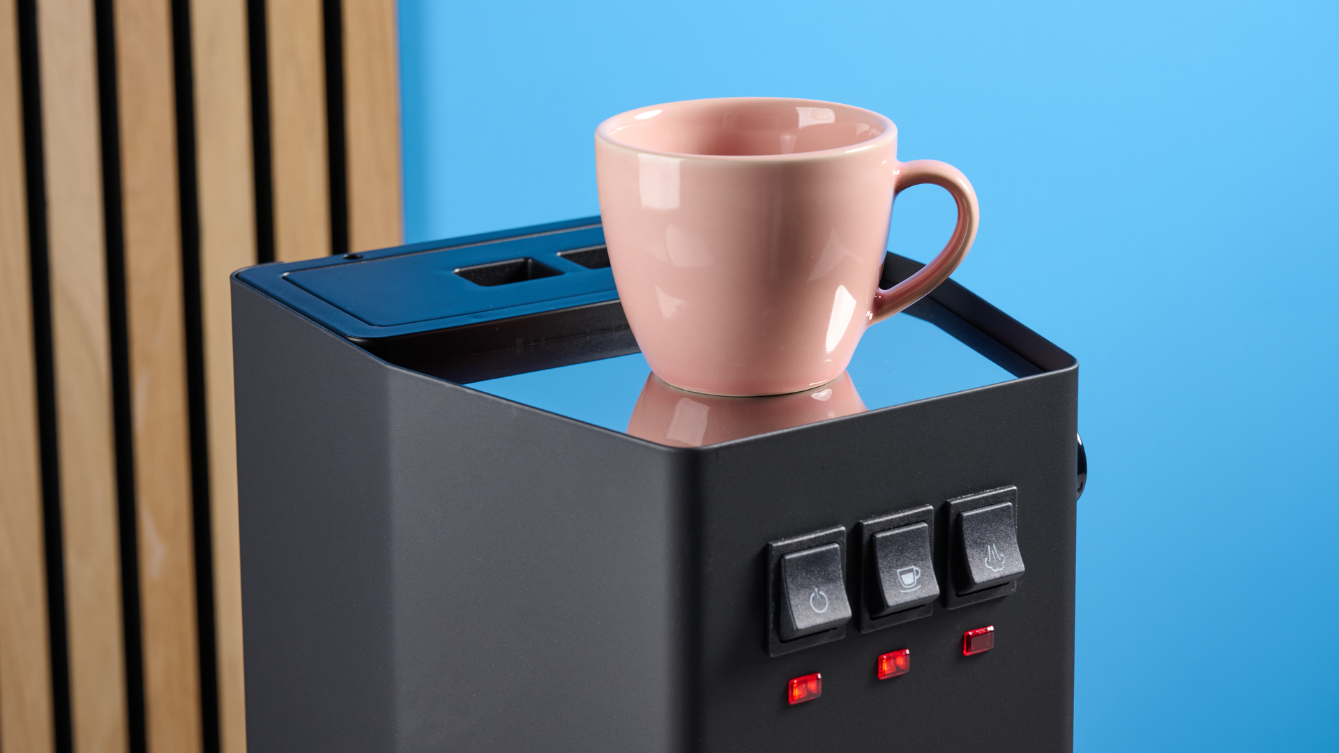 The Gaggia Classic E24 Evo Pro cup warmer with a pink cup on top