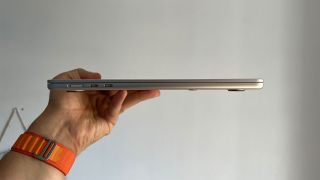 MacBook Air M2 in the hand of the reviewer
