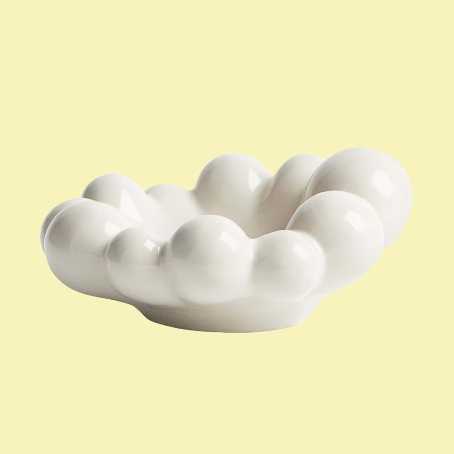 A bubbly ceramic bowl in cream