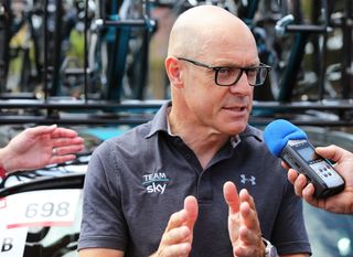 Dave Brailsford talking with the press