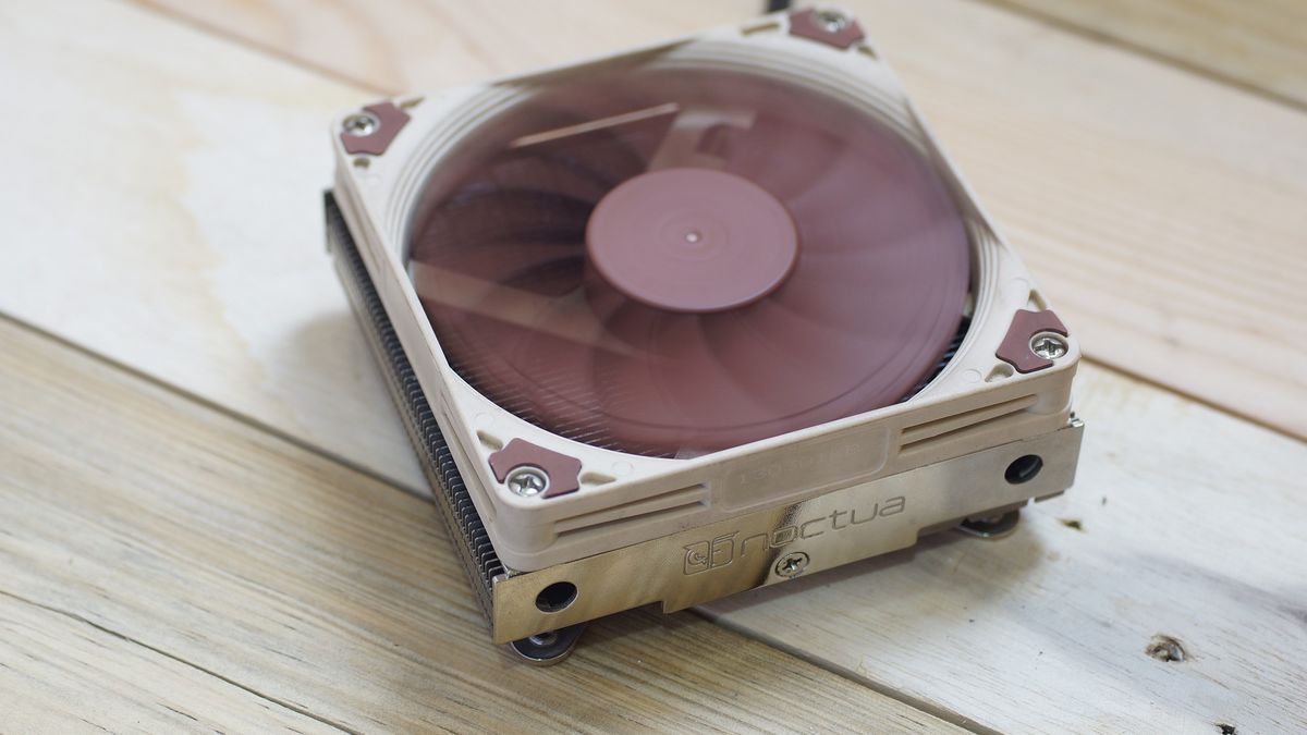 A brown and beige Heatsink Fan NoctuaNH-L9i CPU cooler on wooden slats.